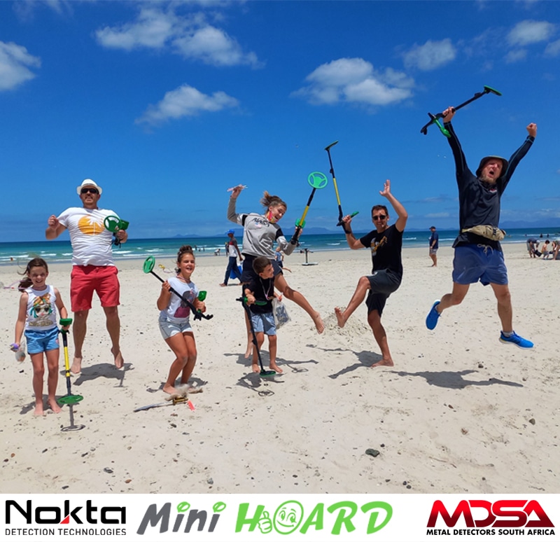 Kids Jumping For Joy With Metal Detectors